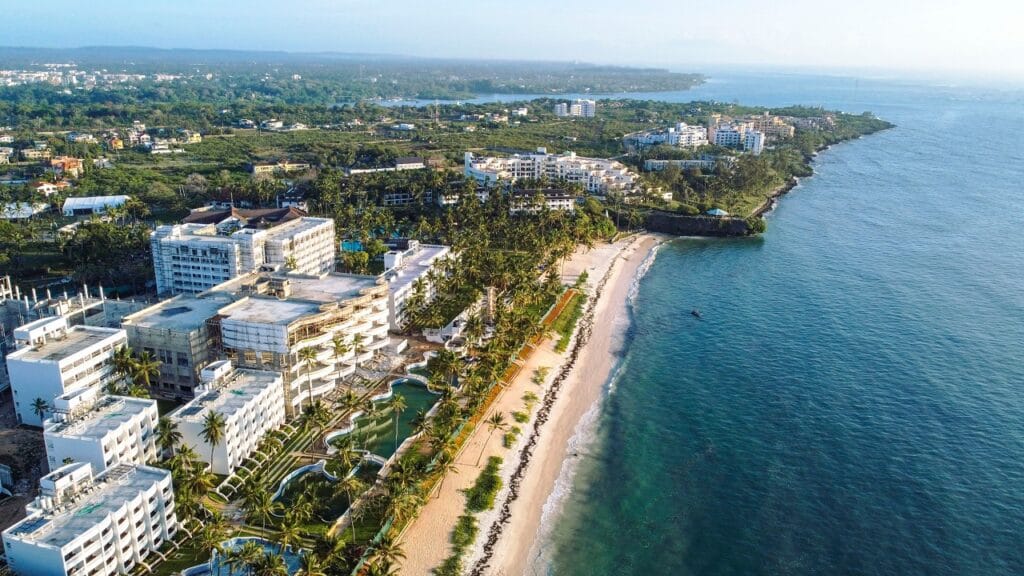 Aerial view of Diani Beach, Kenya, showcasing white sandy beaches and turquoise waters along the coastline.